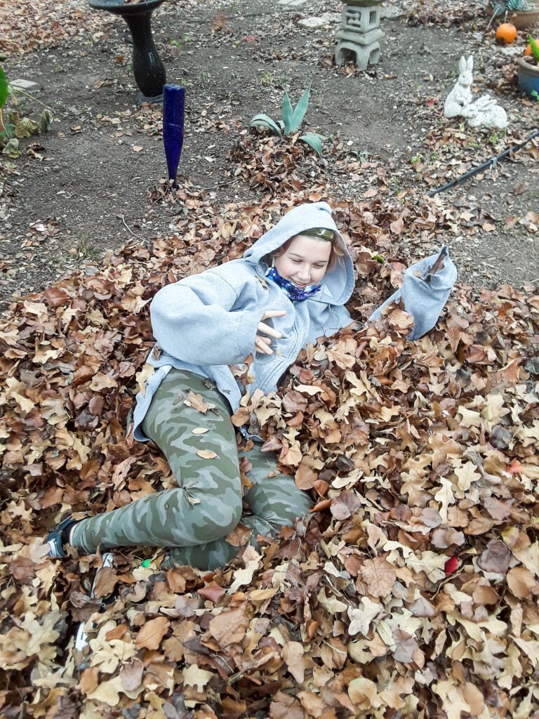 M-plays-in-leaves-Same-Size-9-768x1024